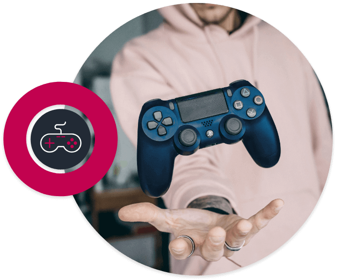 Picture in a circle of man in hoodie with with a video game controller above his hand